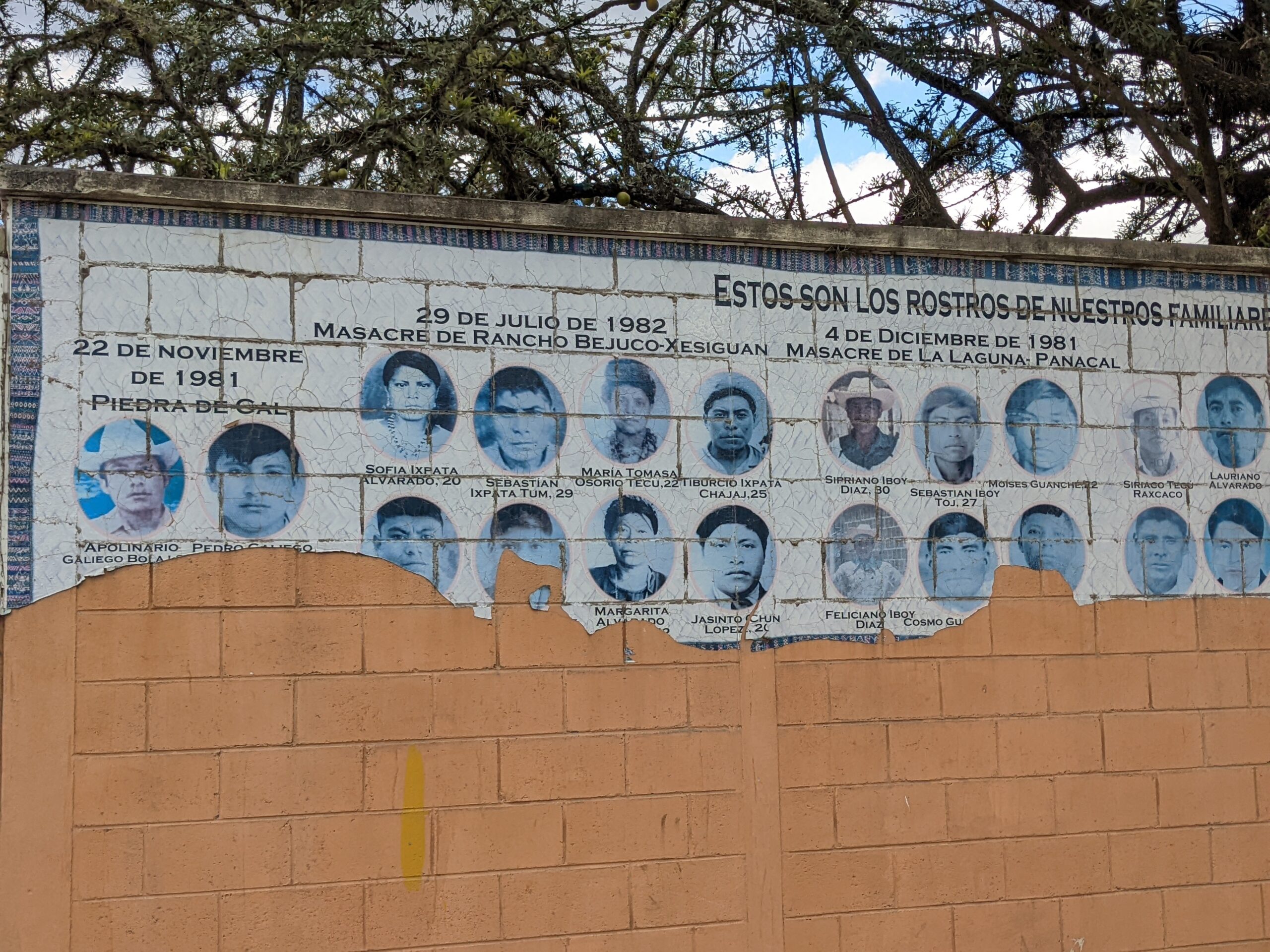 Mural with faces of Rancho Bejuco massacre victims.
